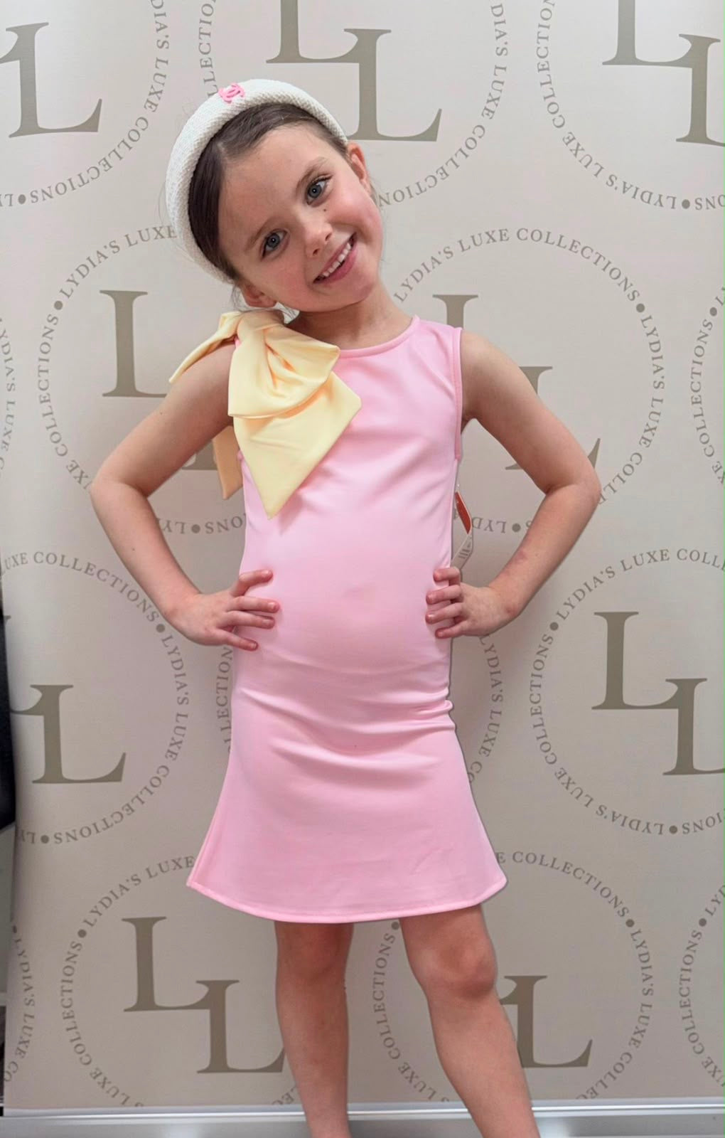 Girls Pink Sleeveless Dress with Oversized Yellow Bow