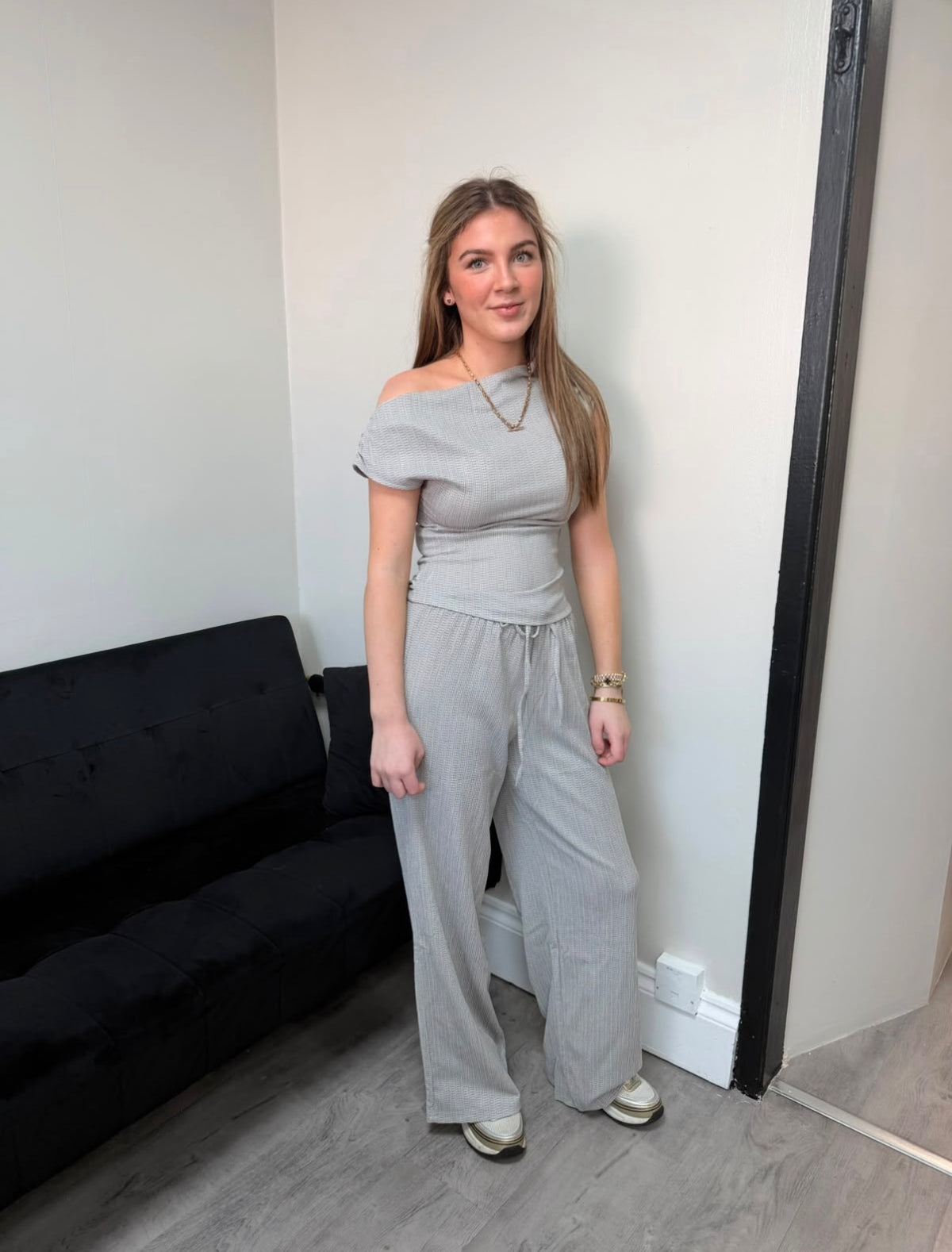 Off-shoulder grey knit top + wide-leg trousers